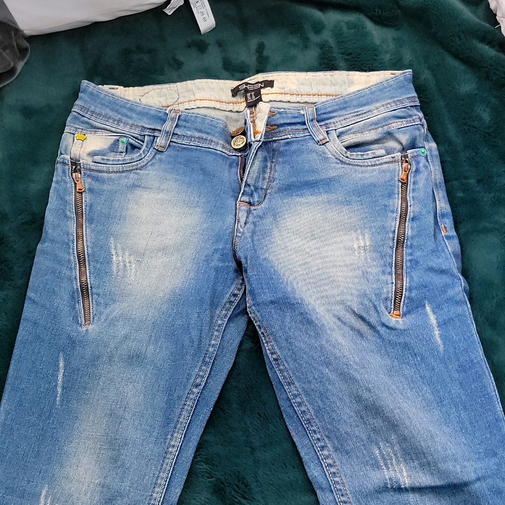 Navy blue ripped jeans with chain details. US size 4, skinny fit